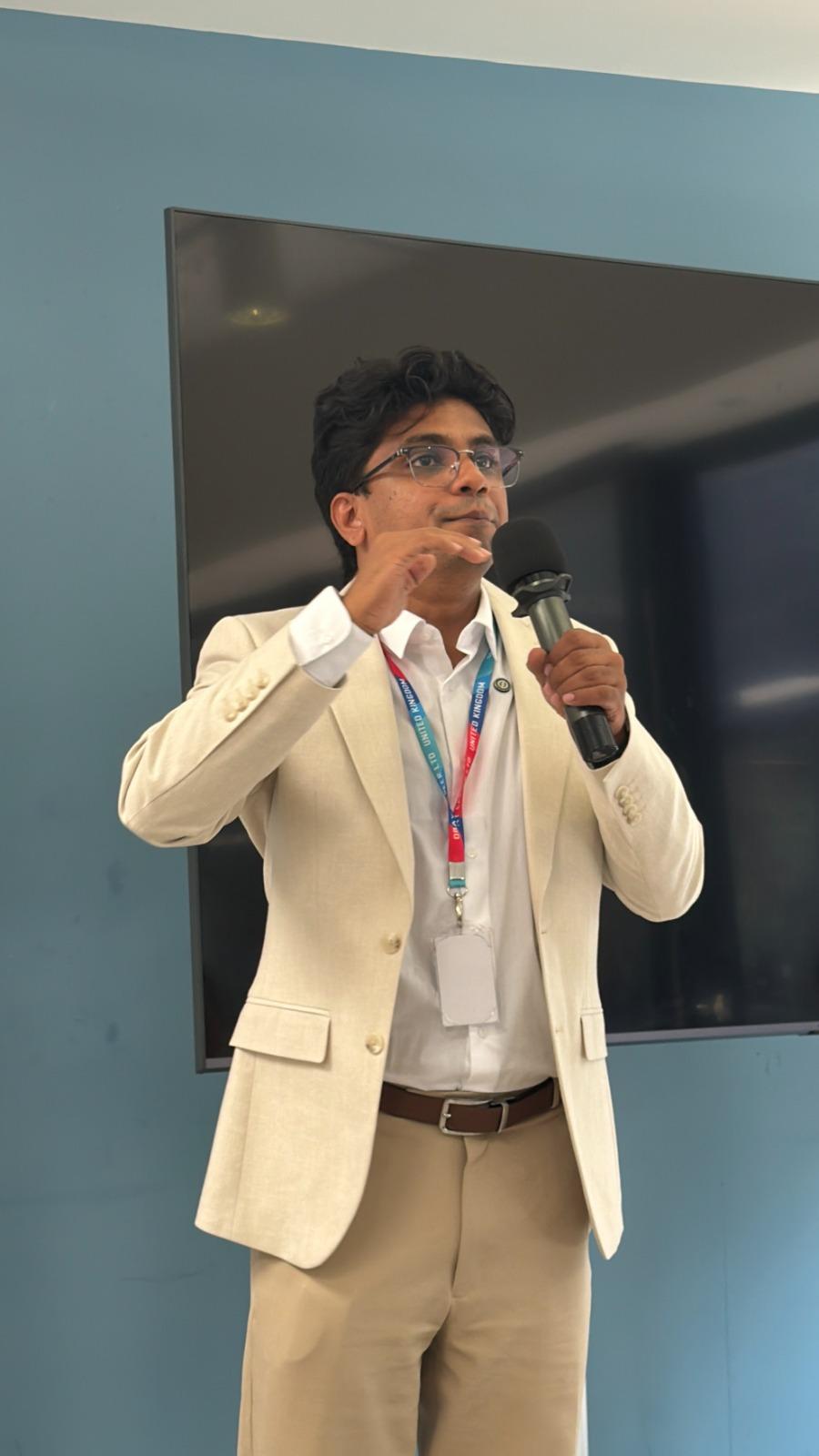 Fazil Karatt speaking at an event